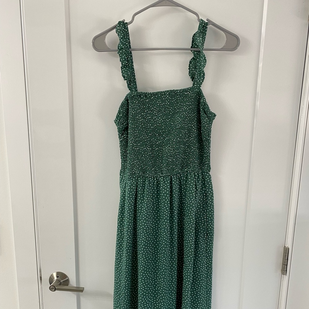 Green polka dotted smocked dress